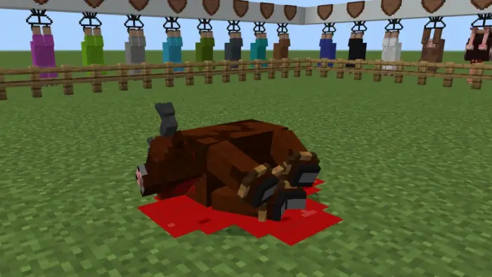 Butchered animal with blood on grass