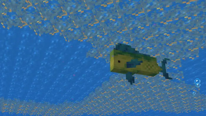 Blocky yellow fish swims in a glass aquarium.