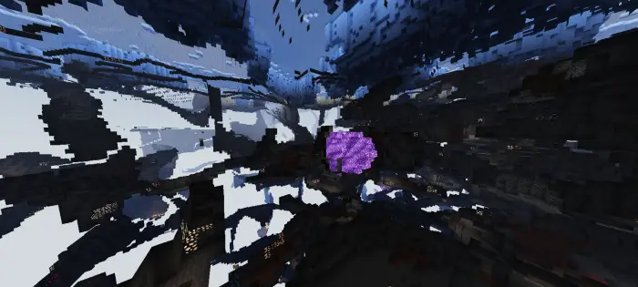 Glowing ores and blocks in dark cave.