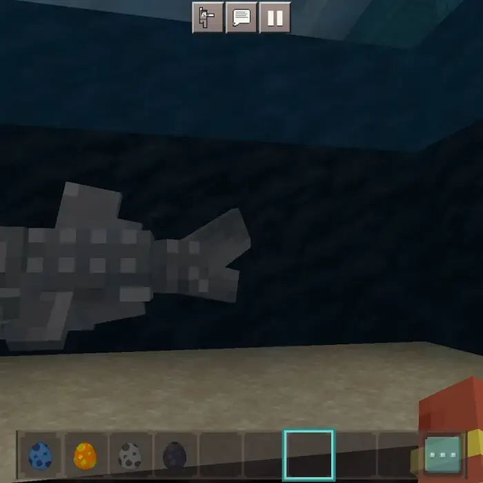Pixelated fish swimming in an aquarium tank.