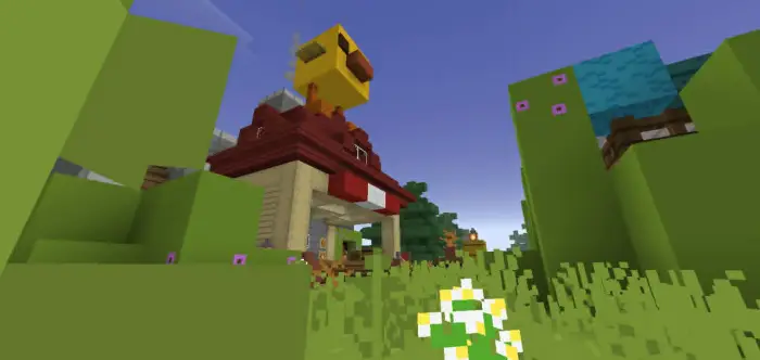 Cartoon farmhouse with a chicken statue