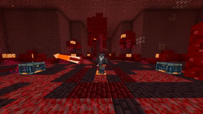 Player with glowing sword in a red cavern.