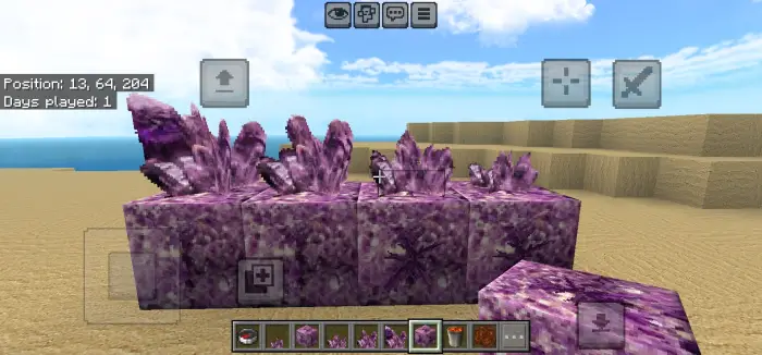 Purple crystal blocks in a sandy landscape