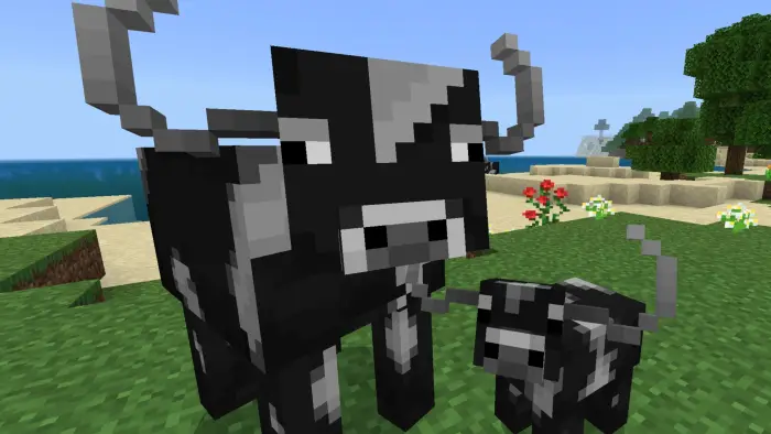 Blocky black-and-white cows on grassy terrain