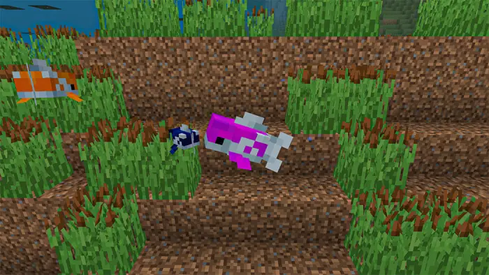 Colorful pixel fish swim among underwater grass.