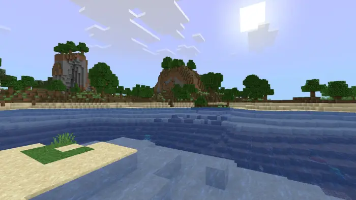 Blocky shoreline with hills and trees