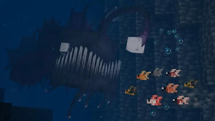 Large anglerfish and colorful fish underwater