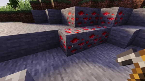 ALT text Red ore vein with pickaxe in hand