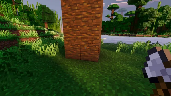 Player holding axe near large tree trunk