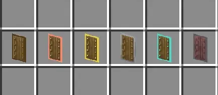 Five wooden shields with colored metal trims.