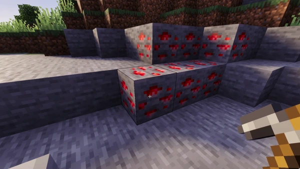Cluster of red ore blocks being mined