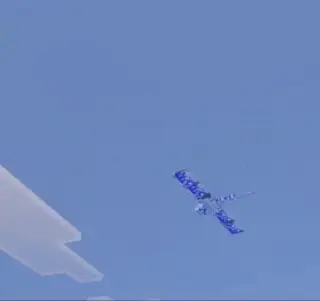 Blue winged creature flying in the sky