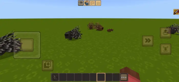 Porcupine-like creatures on green terrain.