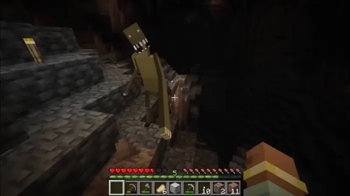Tall cave creature lurking in a dark cavern.