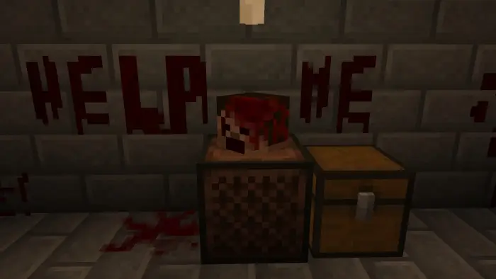 Severed head, blood, HELP ME on wall