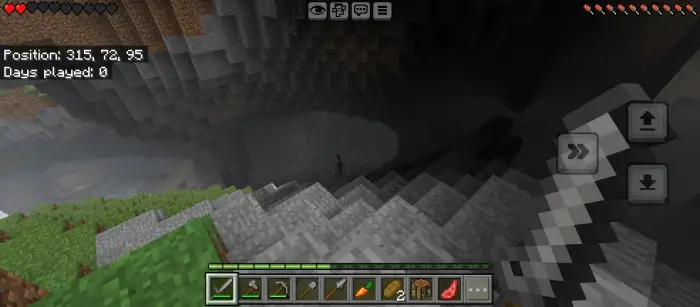 Player faces eerie figure in a dark cave