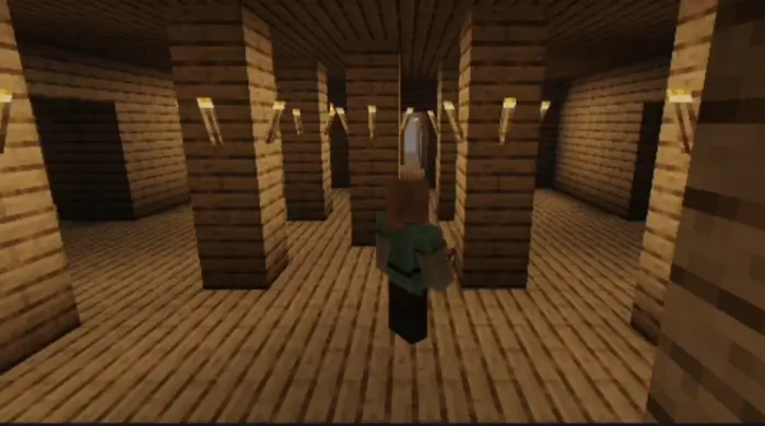 Player exploring a dimly lit wooden hallway