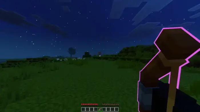 Character holds glowing staff at night outdoors