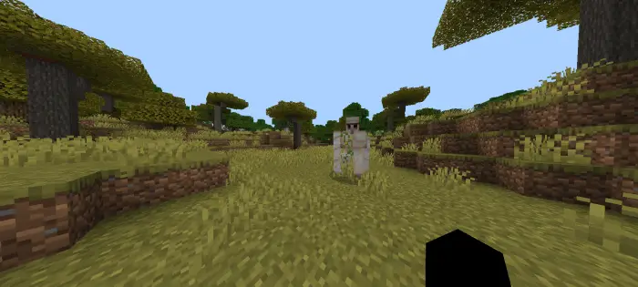 Hostile golem approaches in grassy biome
