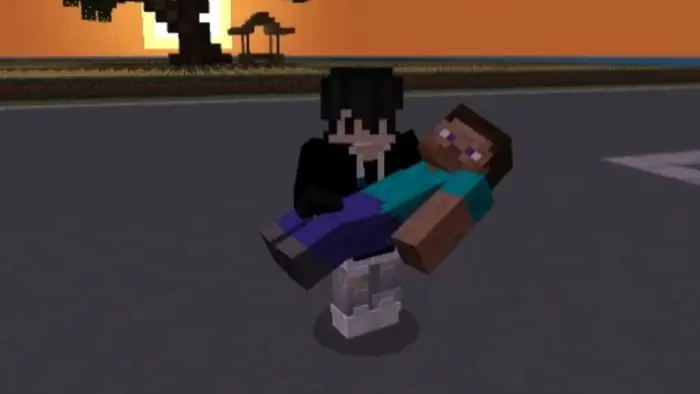 Player carrying another at sunset