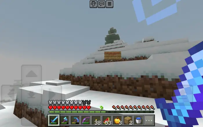 Player explores snowy hill with a sword drawn