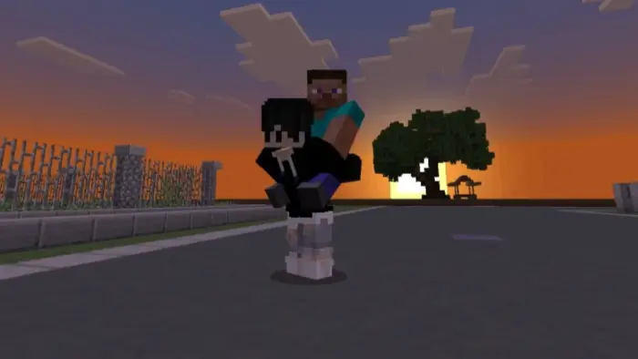 Player giving another a piggyback ride at sunset