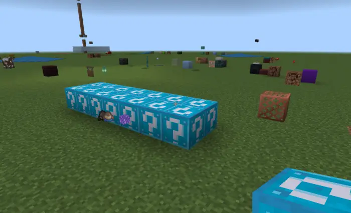 Row of blue lucky blocks on grassy field
