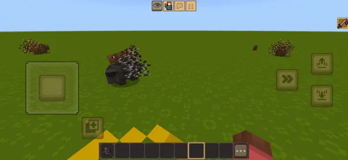 Blocky porcupine creatures on grassy plain