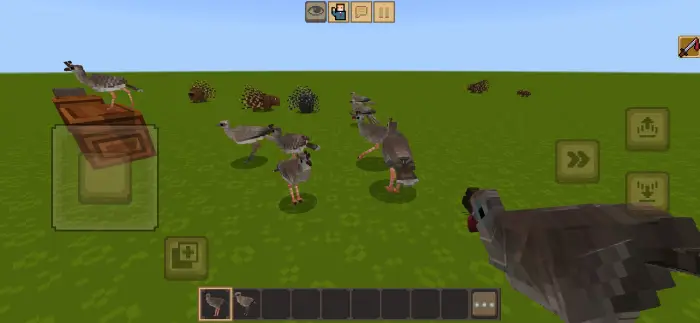 Blocky prehistoric birds roam grassy terrain.