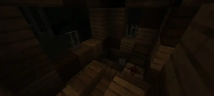 Dark, abandoned wooden room with blood stain