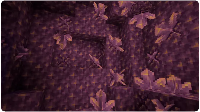 Purple crystals growing on textured cave walls