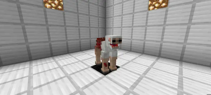 Blocky parasite creature in a white room