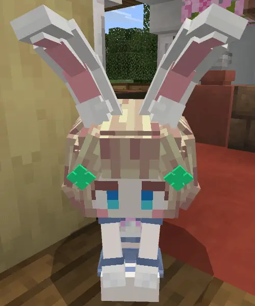 Blocky bunny-eared companion sitting indoors