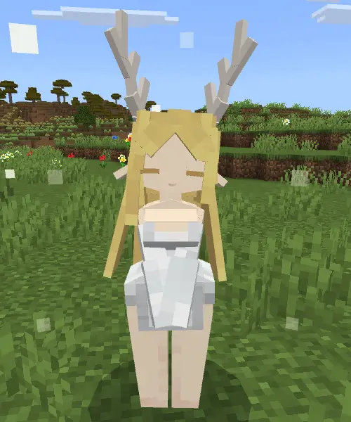 Blocky companion with antlers in a field