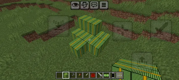 Green and yellow striped blocks on grass.