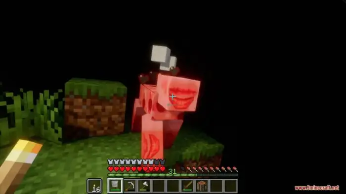 Player faces eerie, red monster in darkness.