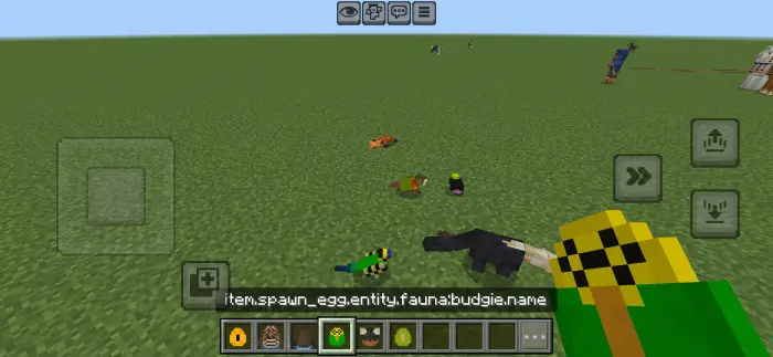 Colorful animals and eggs on grassy terrain