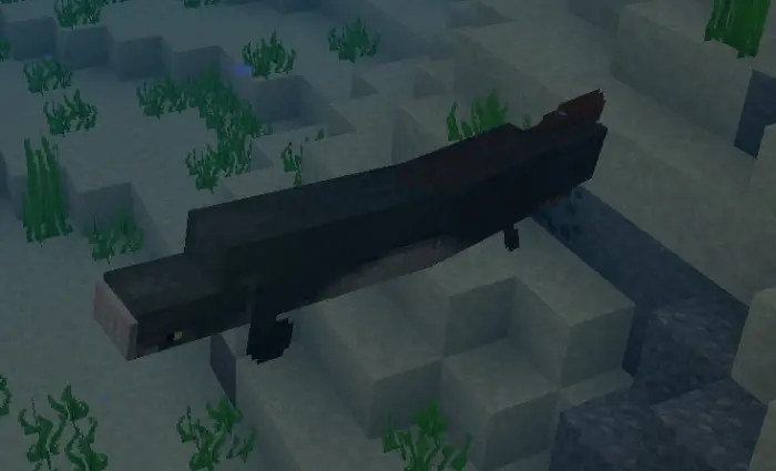 Blocky sea creature swims among ocean plants
