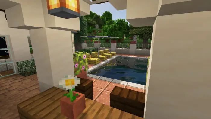 Villa patio view with pool and garden.