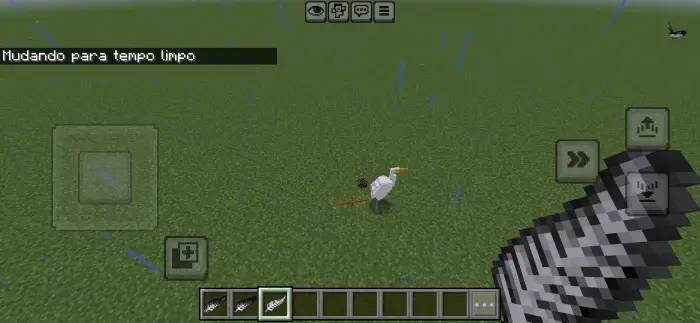 Bird and player on grassy terrain in rain.