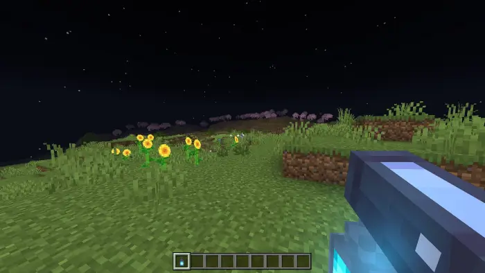 Bright night landscape with sunflowers and tool