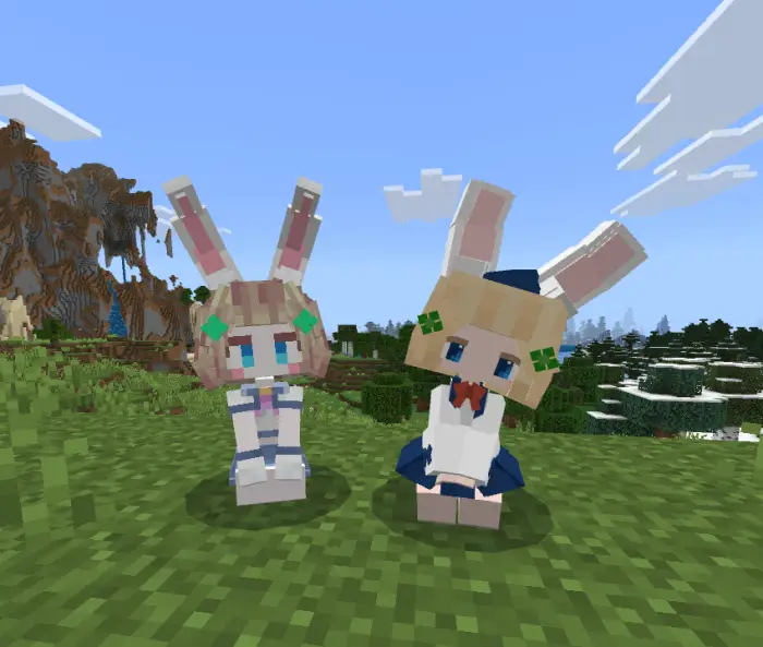 Two bunny-eared companions on grassy hill