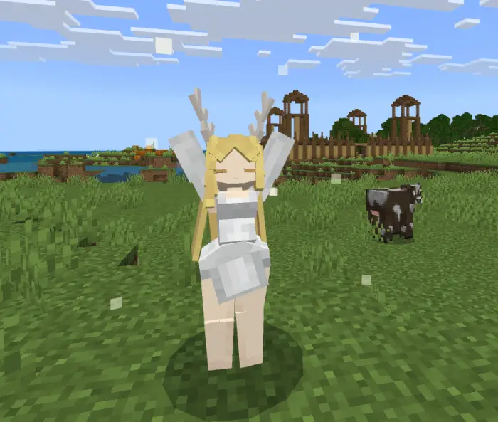 Blonde companion with antlers in grassy field