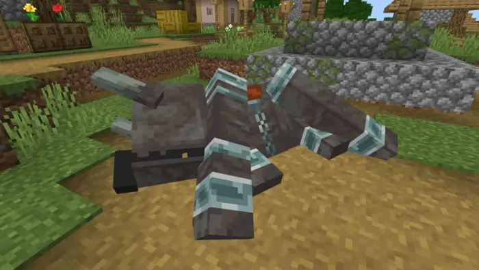 Large armored creature lying defeated on path