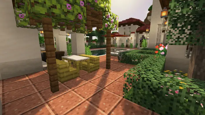 Outdoor dining area with vines and garden