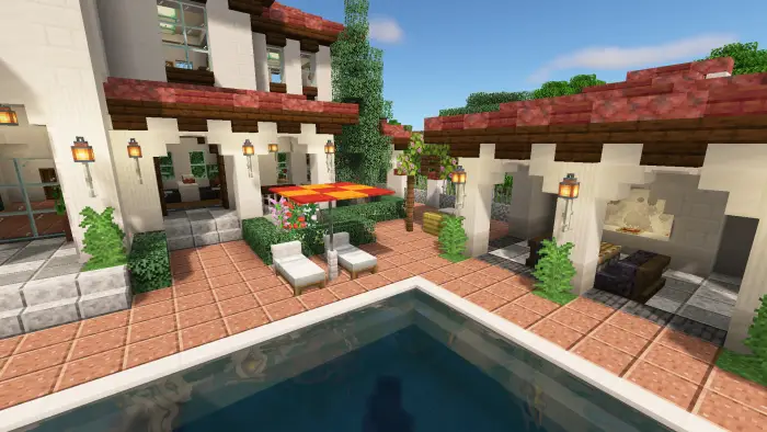Spanish villa patio with pool and lounge chairs