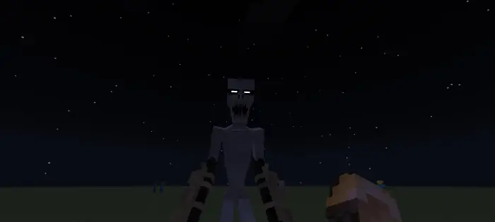 Blocky creature with glowing eyes at night