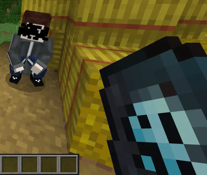 Blocky companion character crouching by hay.
