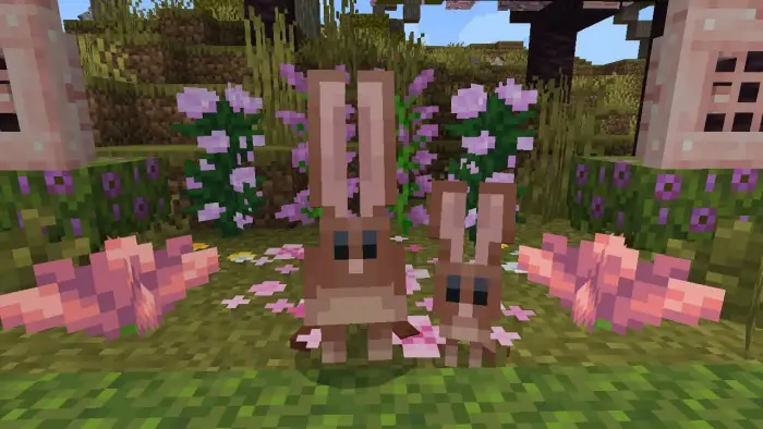 Two blocky rabbits among pink flowers