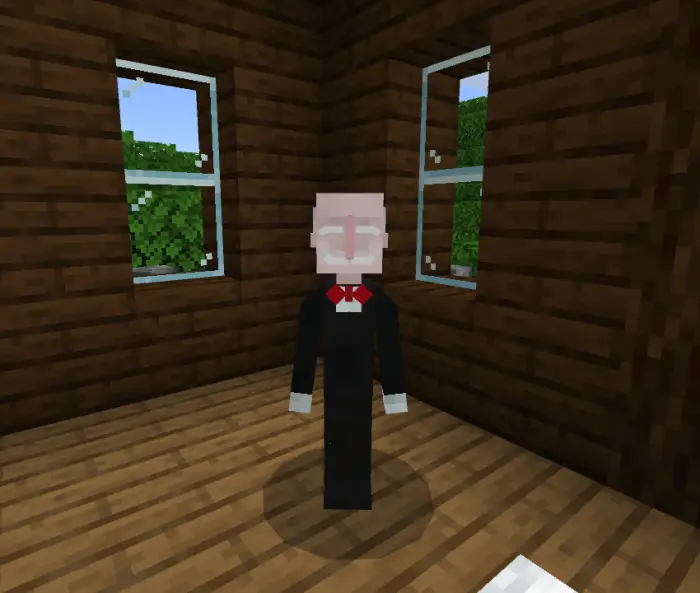 Blocky companion in suit stands indoors